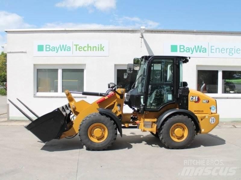 CAT 907 لوادر بعجل