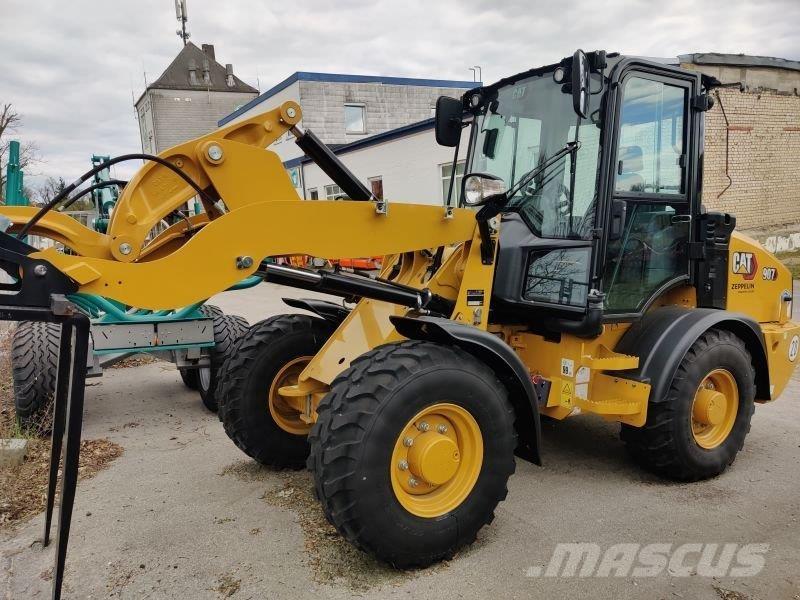 CAT 907 لوادر بعجل