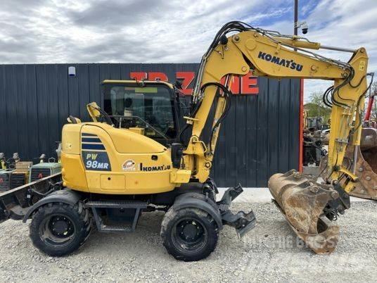 Komatsu PW98MR-10 حفارات بعجل